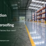 Worn concrete floor next to an epoxy-coated floor in a warehouse