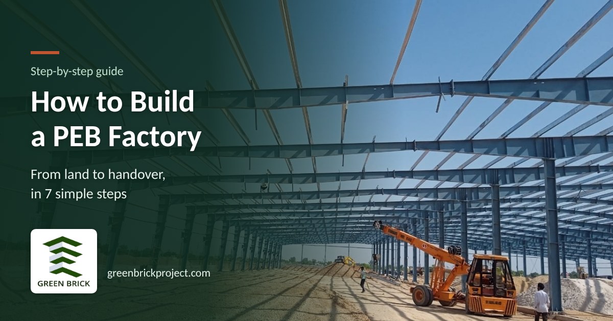 Steel PEB frames being erected with a crane on a factory site